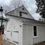 The old house with metal roof and lamp light