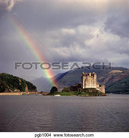 Stock Photo of Eilean Donan Castle situated on a sea lock with a.