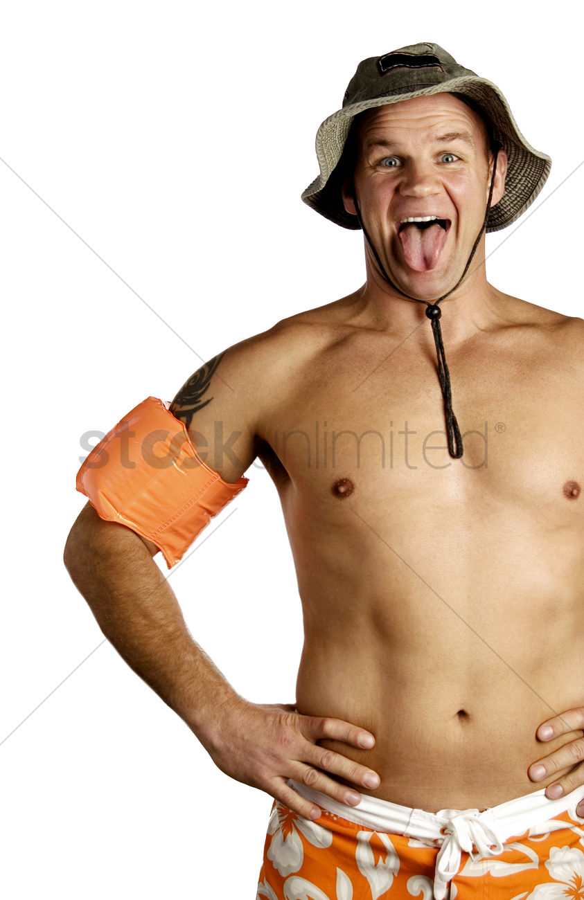 Shirtless man sticking out his tongue Stock Photo.