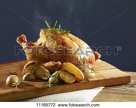 Stock Photo of Rosemary chicken with oven potatoes 11165772.