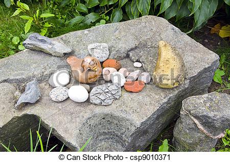 Stock Photography of Ancient retro rock stone garden figure bird.