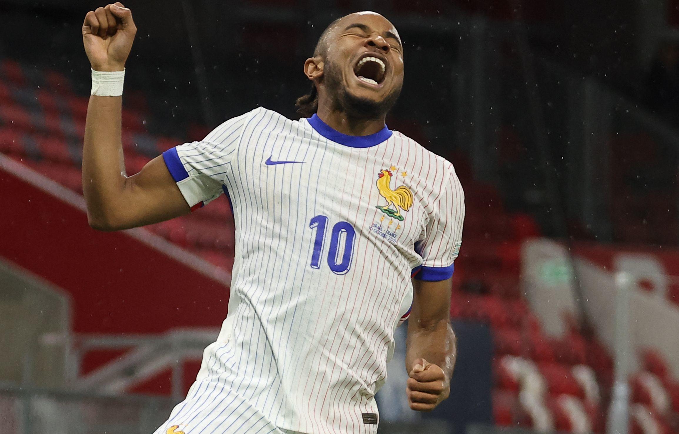 Christopher Nkunku hurle sa joie, ce jeudi soir, après son premier but avec les Bleus en 11 sélections. AFP/Franck Fife