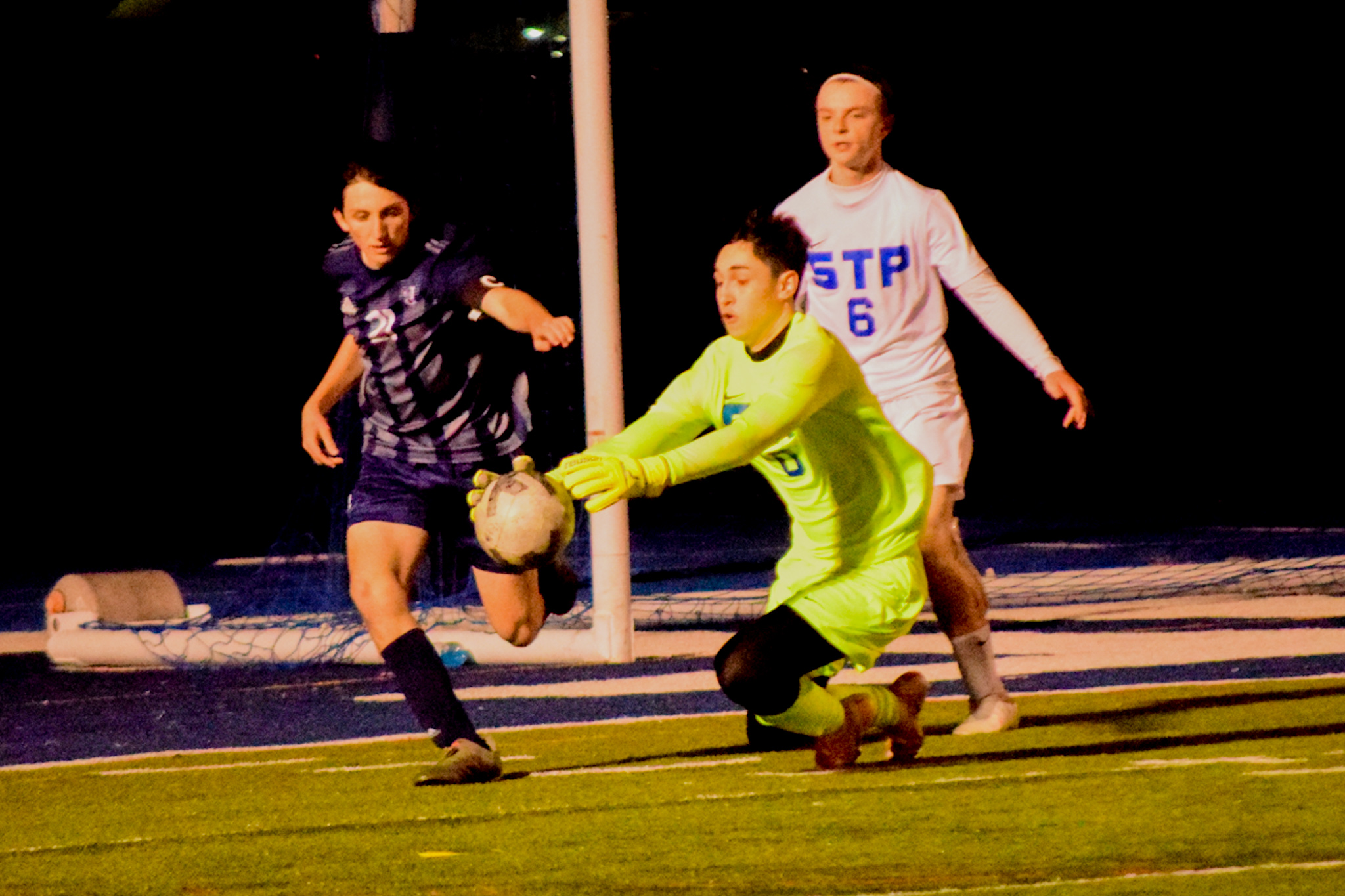 St. Peter's goalkeeper Jason Skretvic grabs the ball just before St. Joseph by-the-Sea's Aidan Hayes can gain control. (Staten Island Advance/Annie DeBiase)