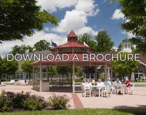 Picture of residents in front a gazebo that states download a brochure