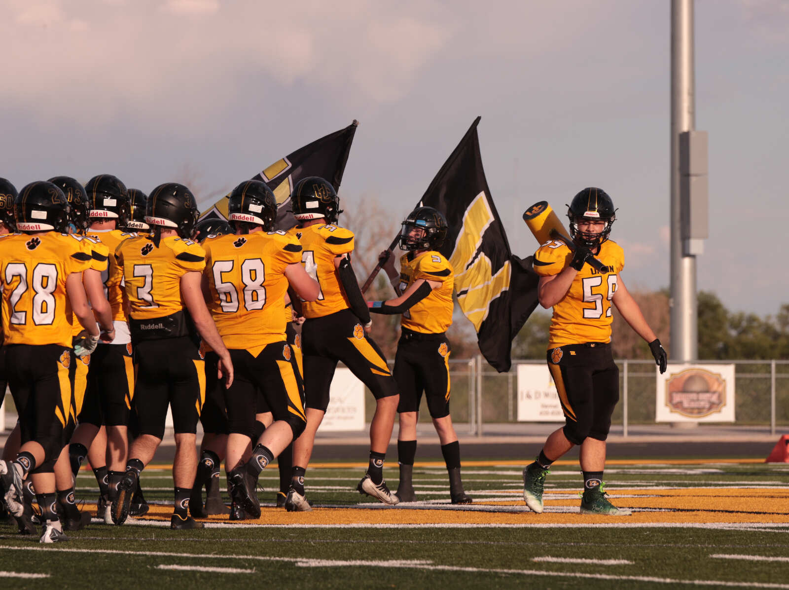 Kolby Winterton Holds the Hammer with Jackson a flag bearer comes out to the field