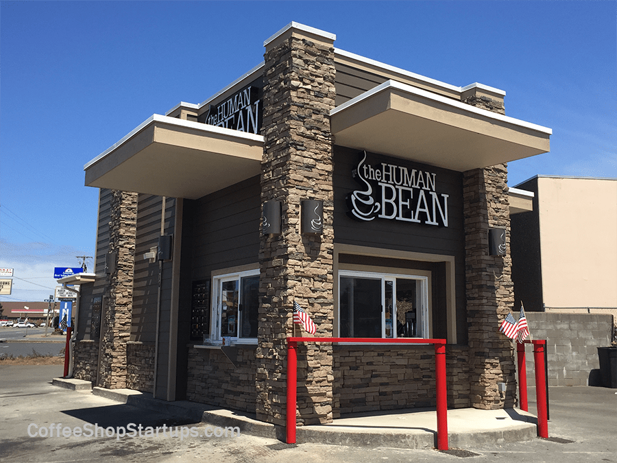 A drive-thru coffee stand serves customers