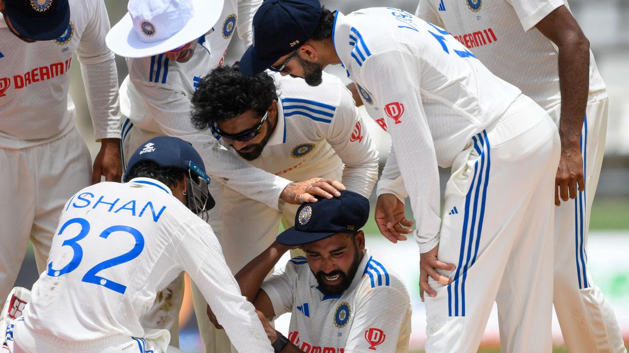 Mohammed Siraj (C), of India, celebrates the dismissal of Jermaine Blackwood, of West Indies, during day one of the First Test between West Indies and India at Windsor Park in Roseau, Dominica, on July 12, 2023. (Photo by Randy Brooks / AFP)