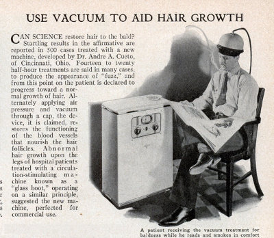 Vintage using baldness cure vacuum and reading a book.