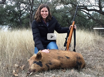 Female hunter with feral hog