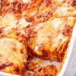 baked lasagna bolognese in a white baking dish