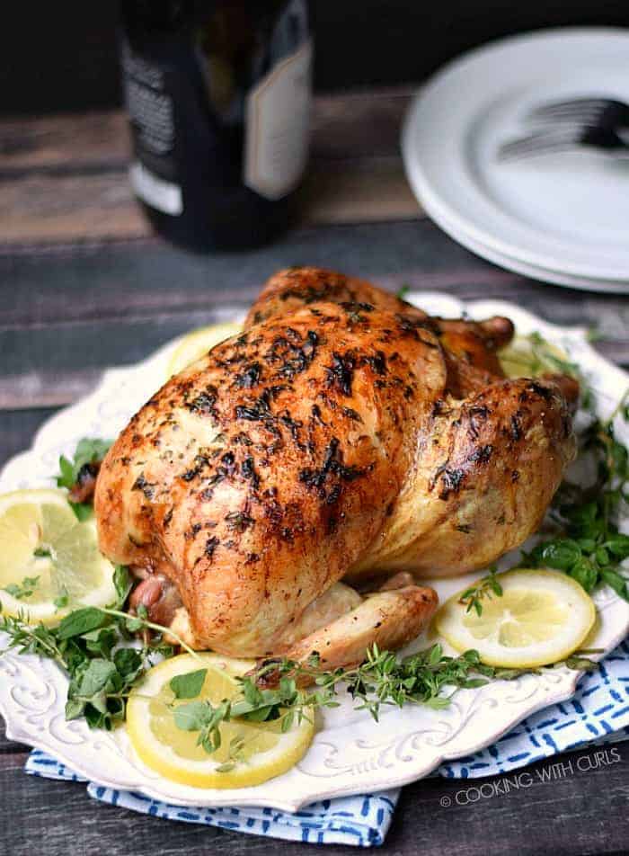 This Greek Roasted Chicken is crispy on the outside, tender and juicy on the inside and loaded with flavor! cookingwithcurls.com