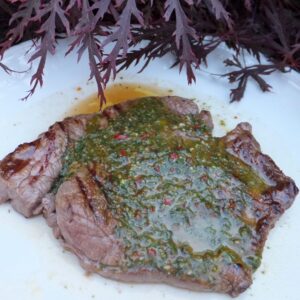 Steak with basil sauce