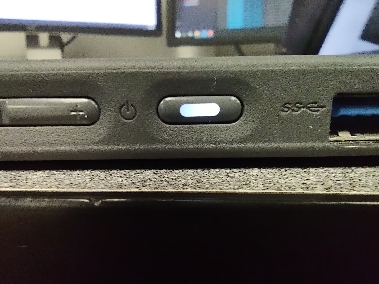 Side of a Chromebook, showing off the power button