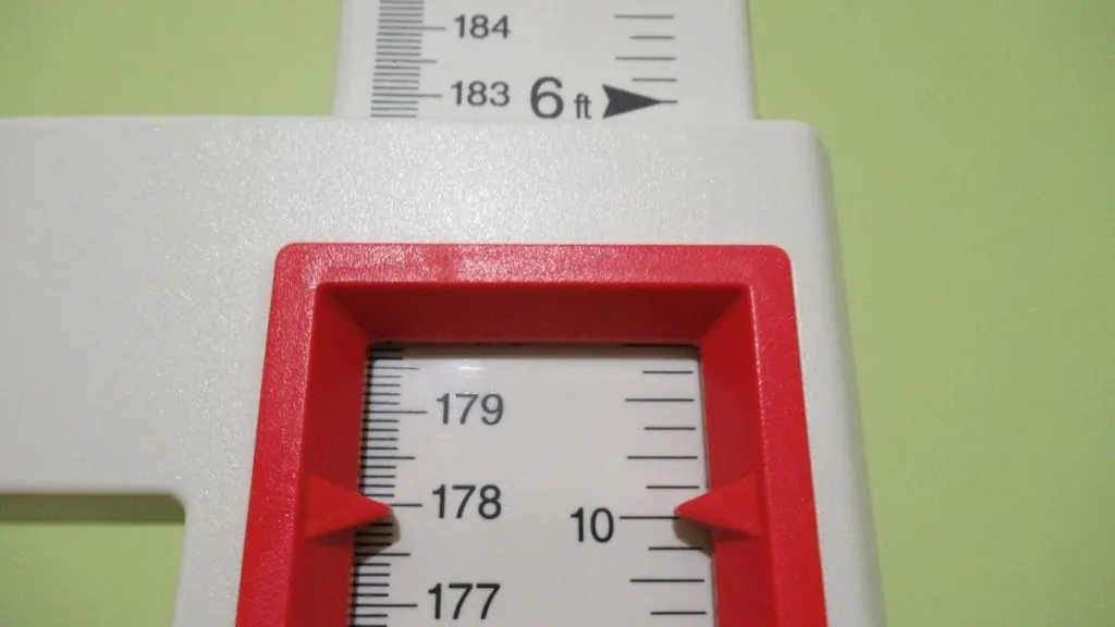 A stadiometer displaying the height 5 feet 10 inches