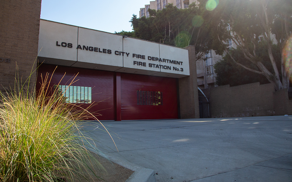 Front view of Los Angeles City Fire Department Station No. 3 with red garage doors.