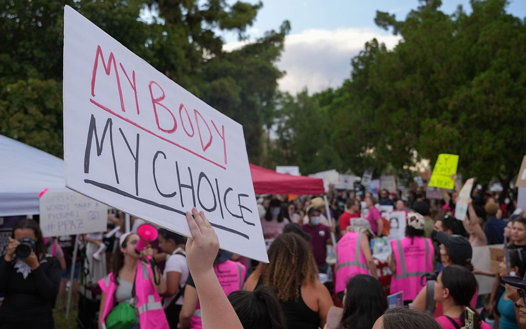 Abortion-rights activists rally outside the Arizona Capitol in June 2022 to protest the U.S. Supreme Court’s ruling in Dobbs, which overturned Roe v. Wade.