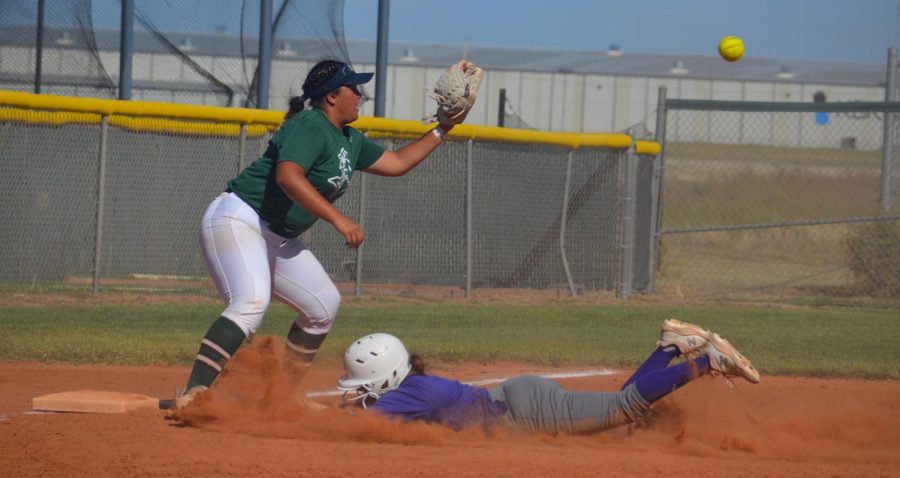 Fixing to catch the ball is third baseman Mari Landa. Landa was the third baseman during the whole scrimmage.