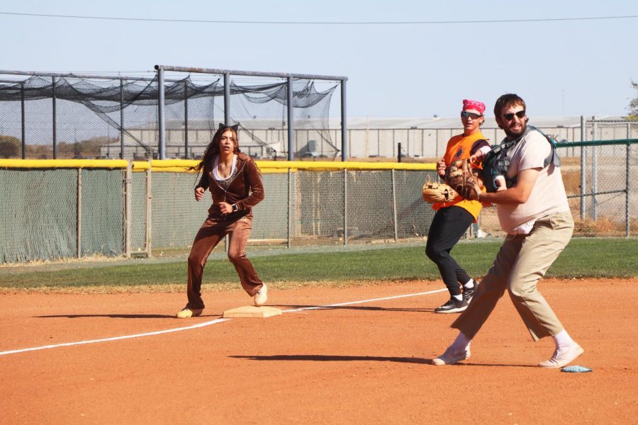 Ashanti Thompson is a cheetah costume. Ashanti Thompson made it to third base and was ready to get home. 