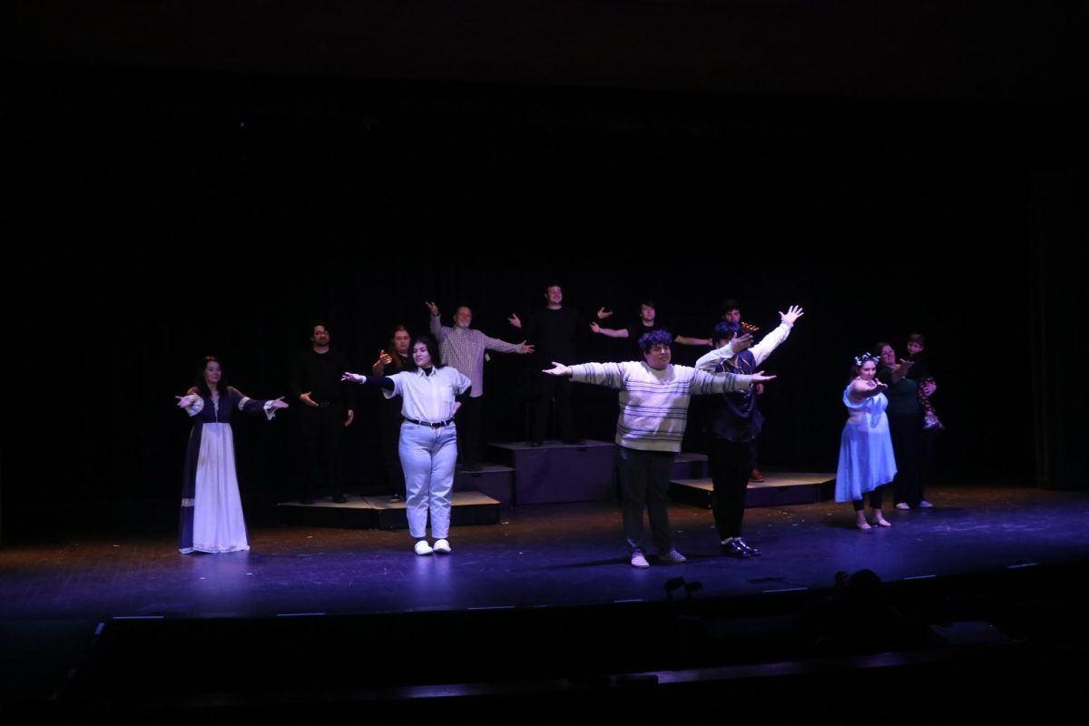 The entire cast of “I Hate Shakespeare” poses and bows to a pretend audience at the end of a practice rehearsal. 