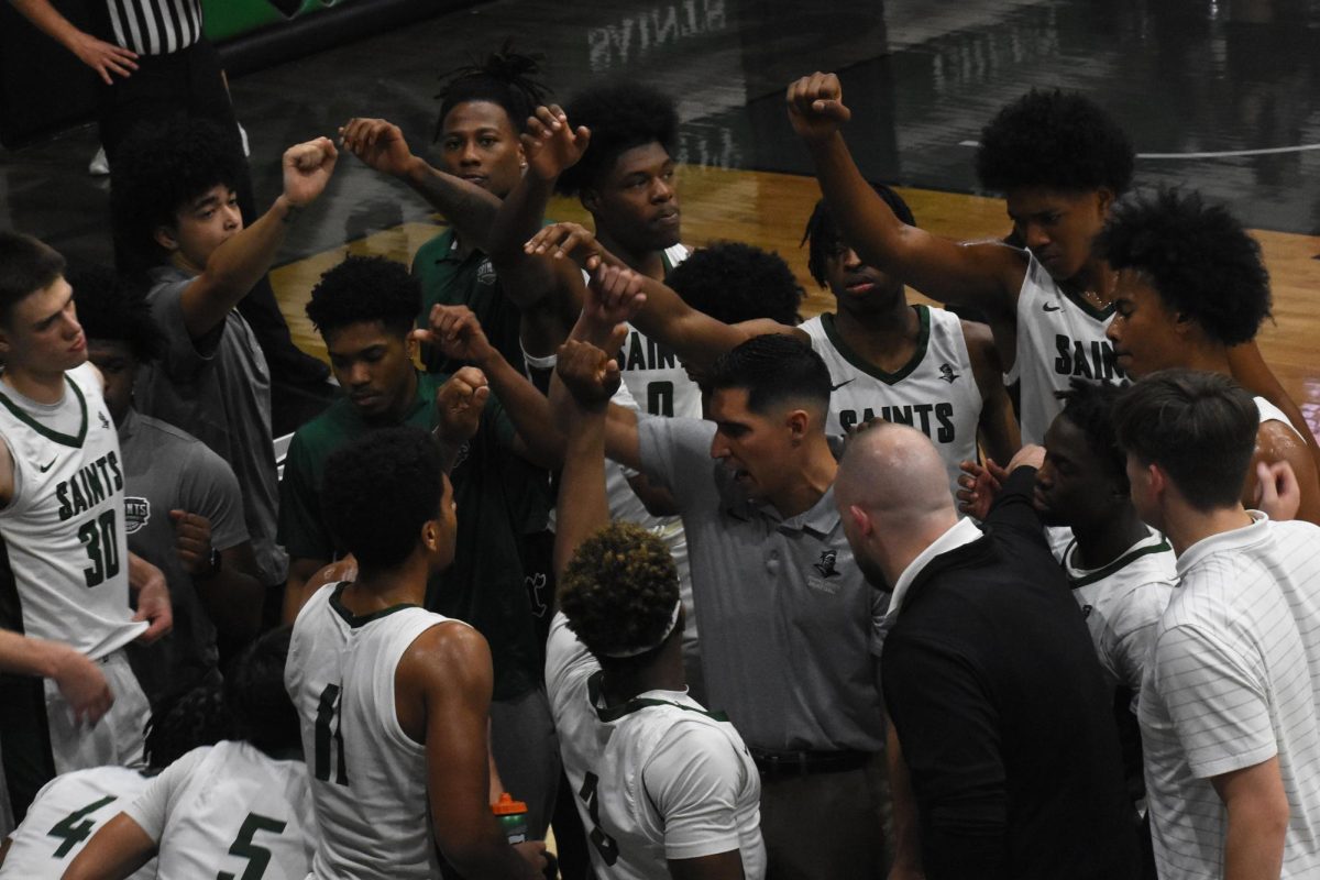 The team breaks it out before taking to the court after a timeout. 