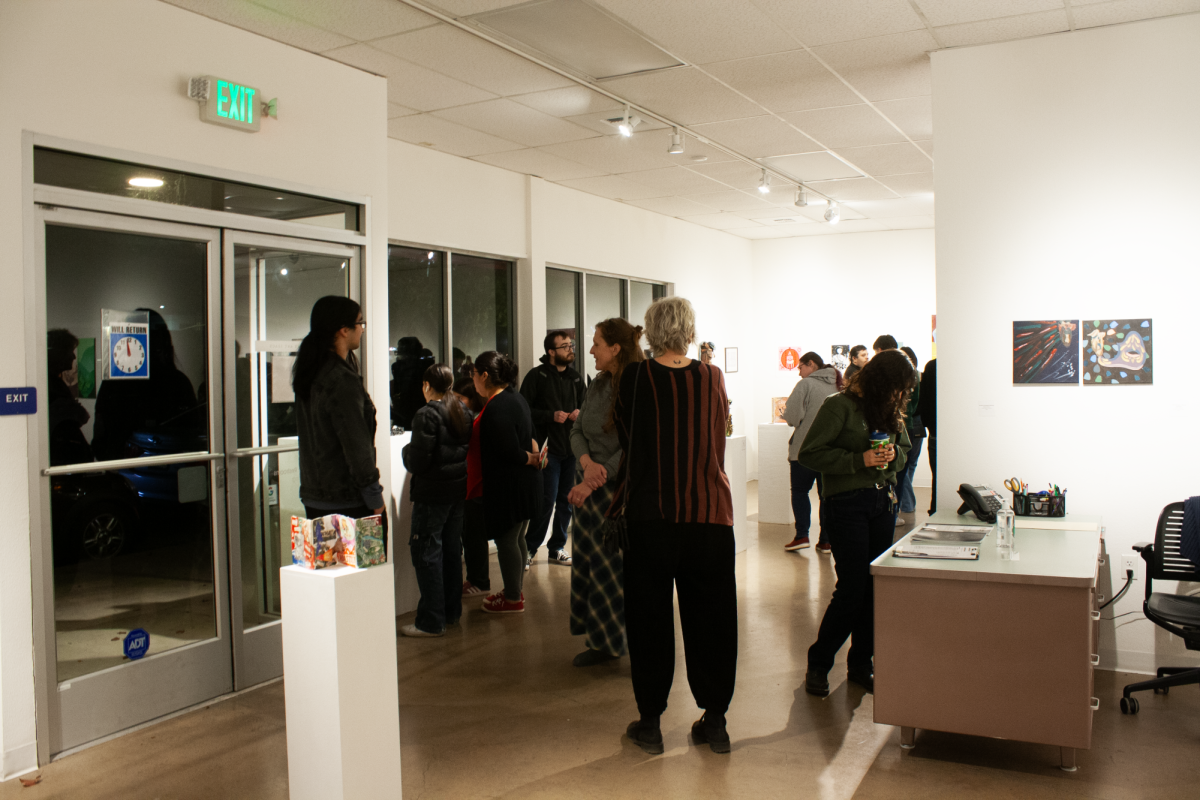 Students, family members and exhibit-goers enjoy the vast array of student pieces.