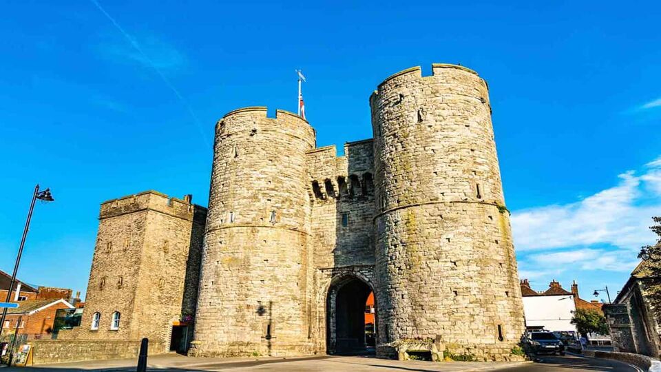 Two ancient stone towers serving as entrance to a city