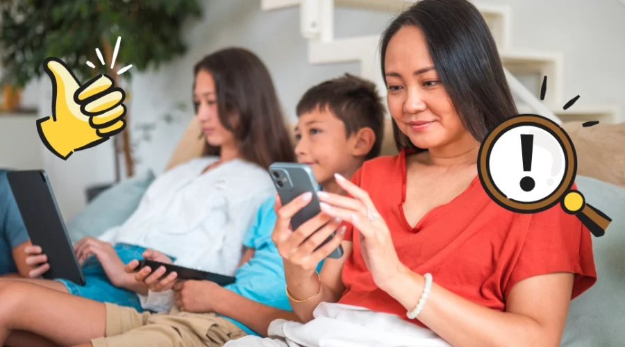 mom on her phone, next to two children