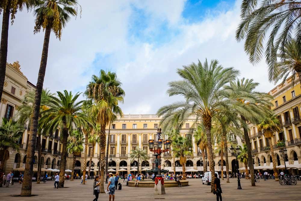 Plaça Reial in Barcelona. The square, with lanterns designed by Gaudi and the Fountain of Three Graces in the center, has a lot of restaurants. Photo: Shutterstock