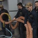 Nimitz Sailors Remove Tow Line