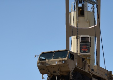 Soldiers unload cargo of knowledge to local dockworkers