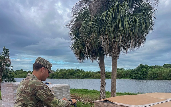 Florida Army National Guard mortarmen set up point-of-distribution site to deliver emergency supplies after Hurricane Milton