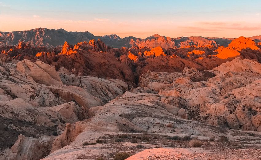 valley of fire state park illuminated red and orange by the setting sun