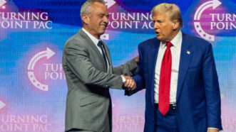 Robert F. Kennedy Jr. shaking hands with Donald Trump | Jen Golbeck / SOPA Images/Sipa USA/Newscom