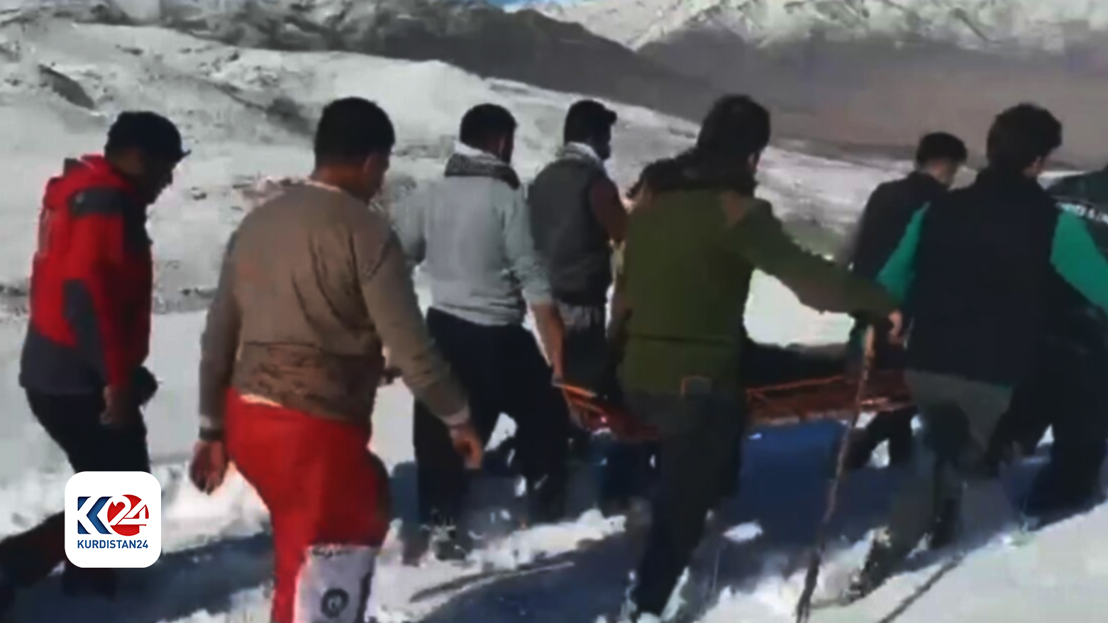 A rescue team navigating through a snow-covered, mountainous area in Oshnavieh, as they carry one of the five hikers who were stranded overnight, Oct. 25, 2024. (Photo: IRNA)