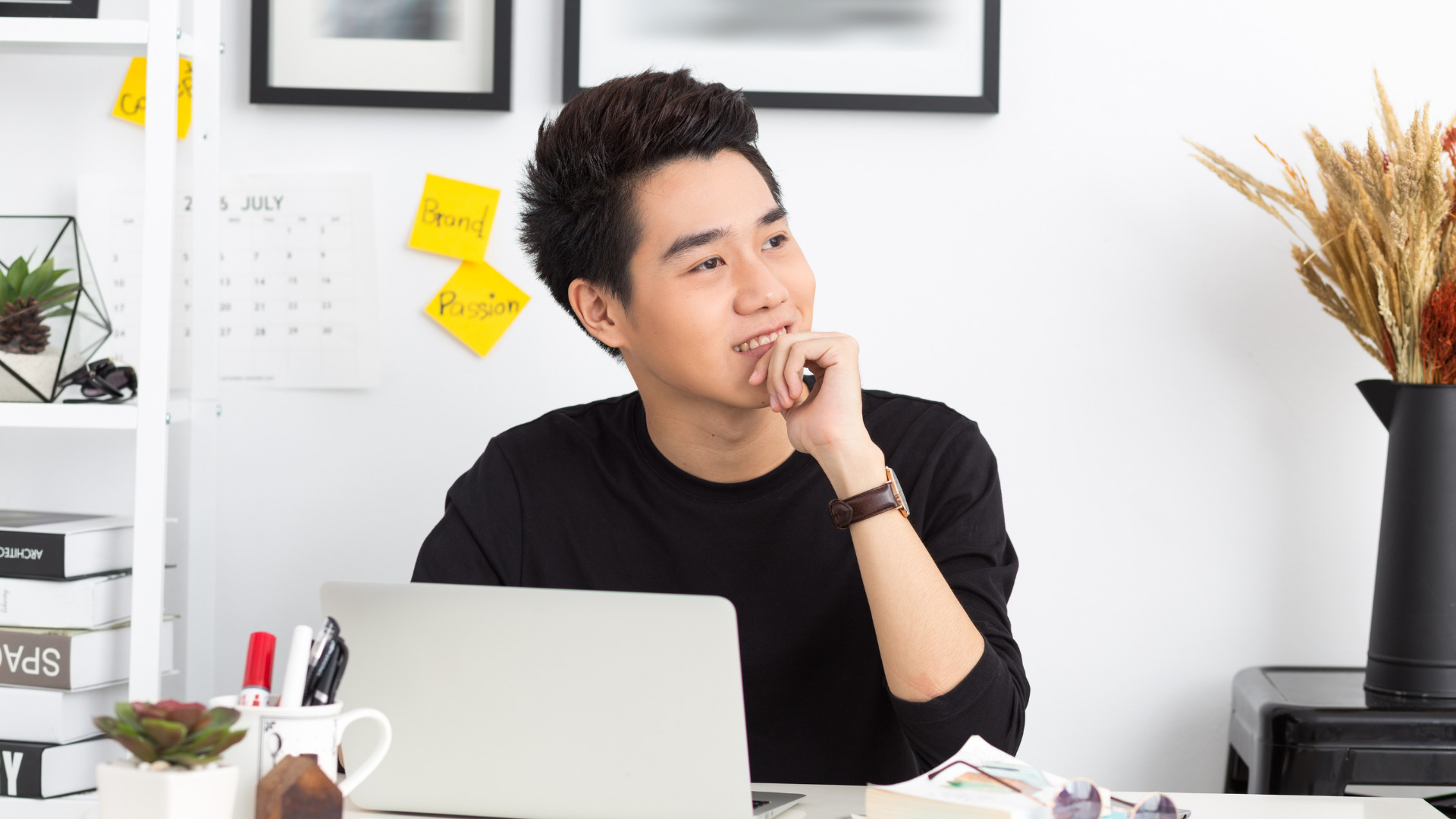 Young Entrepreneur thinking at a desk