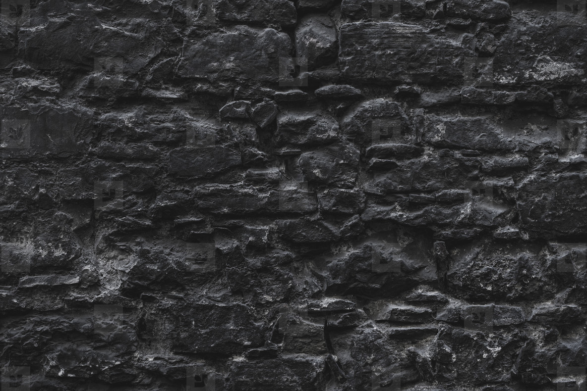 Dark brown old medieval natural stone wall. Texture, background or wallpaper  stock photo (110713) - YouWorkForThem