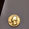 curious about 1967 gold quarter from the bank any suggestions? it is 24k gold.. not sure if it is solid or plated 