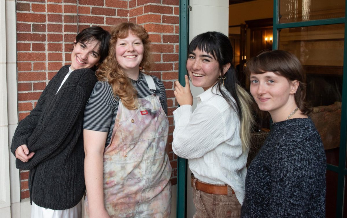 Elle Stephenson, Angel Black, Eva Israelsen and Aspen McCallum smile and pose on the marble steps of Oregon State University's Memorial Union in Corvallis, Oregon, Oct. 24, 2024.