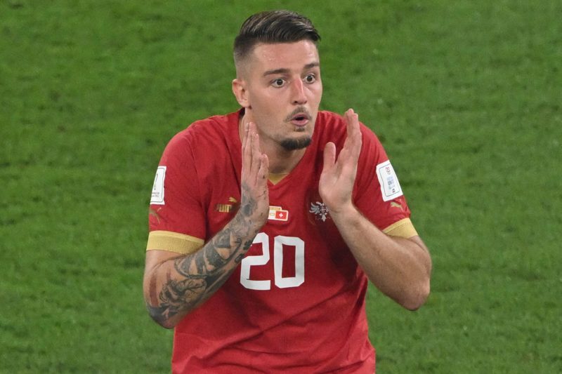 Serbia's midfielder #20 Sergej Milinkovic-Savic reacts after receiving a yellow card during the Qatar 2022 World Cup Group G football match between...