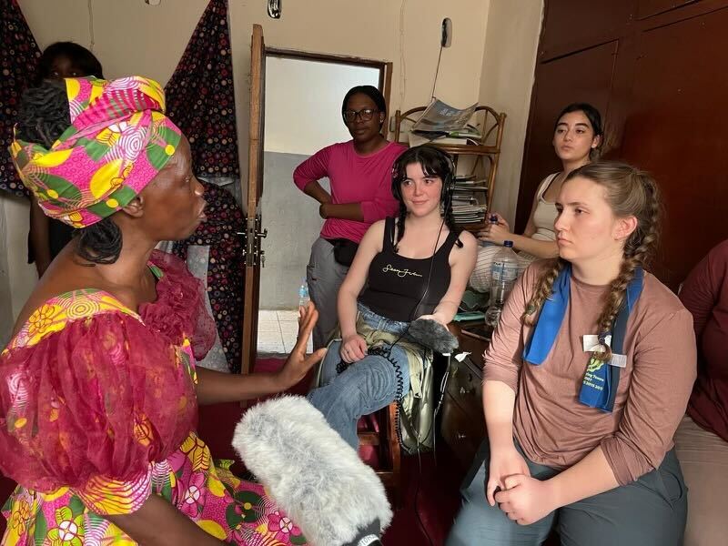 UI students Faith Lee, Elena Cleary, Piper Pascarella and Maggie Knutte sit with Juliet Rhoman, CEO of Uman Tok.