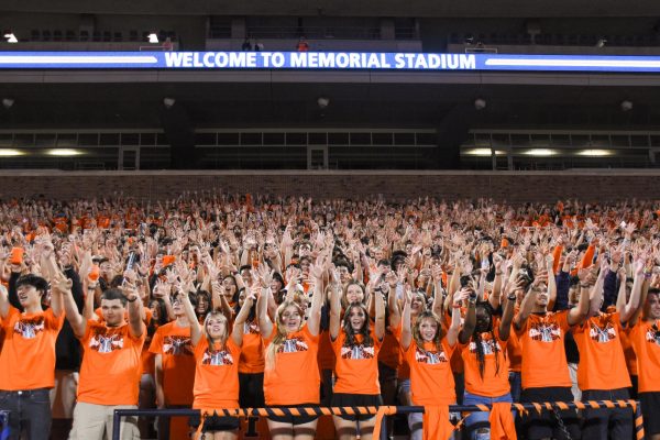 New students practice cheers along with the Marching Illini at Sights and Sounds on Aug. 22, 2024, in Memorial Stadium.