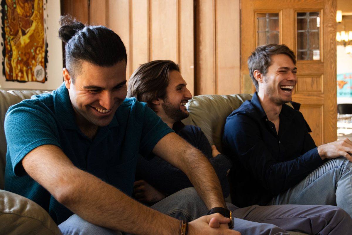 Daniel Fallah from Iran, Joseph Saoud from Lebanon and Eddie Winner from Israel, all graduate students in the College of Law, sit and talk about their experience as international students with families in the Middle East. The three met on campus and remain close friends despite ongoing international conflict involving their home countries.