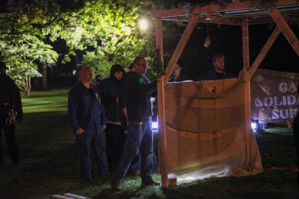 University employees used power tools to deconstruct the wooden structure shortly after 9 p.m.