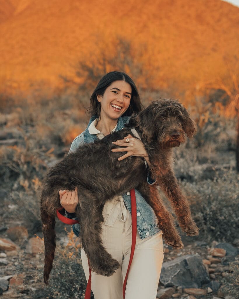 Girl and puppy enjoying sunset in McDowell Sonoran Preserve Arizona