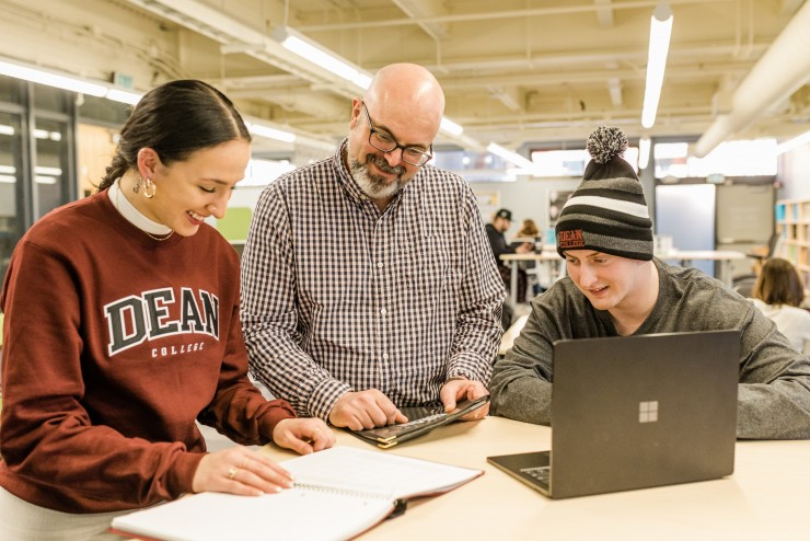 An advisor helping a student in the Map Program. 