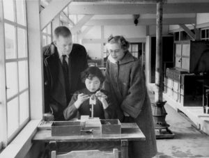 W. Edwards Deming and Lola Deming observe a worker at Mikimoto pearl plant