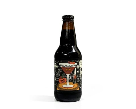 Bottle of Prairie Artisan Ales' Pumpkin Maple Marty Imperial Stout standing on a white background, showcasing its intricate Halloween-themed label with pumpkin and spooky decorations.