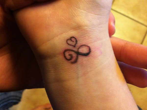 10 Amazing Infinity Symbol Tattoos Designs with Meanings Ideas and  Celebrities  Body Art Guru