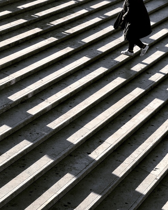 Person walking up steps