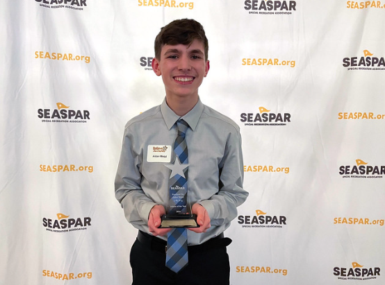 SMILING FROM SUCCESS: Aidan Metzl (10) poses with his Athlete of the Year award Feb. 2.